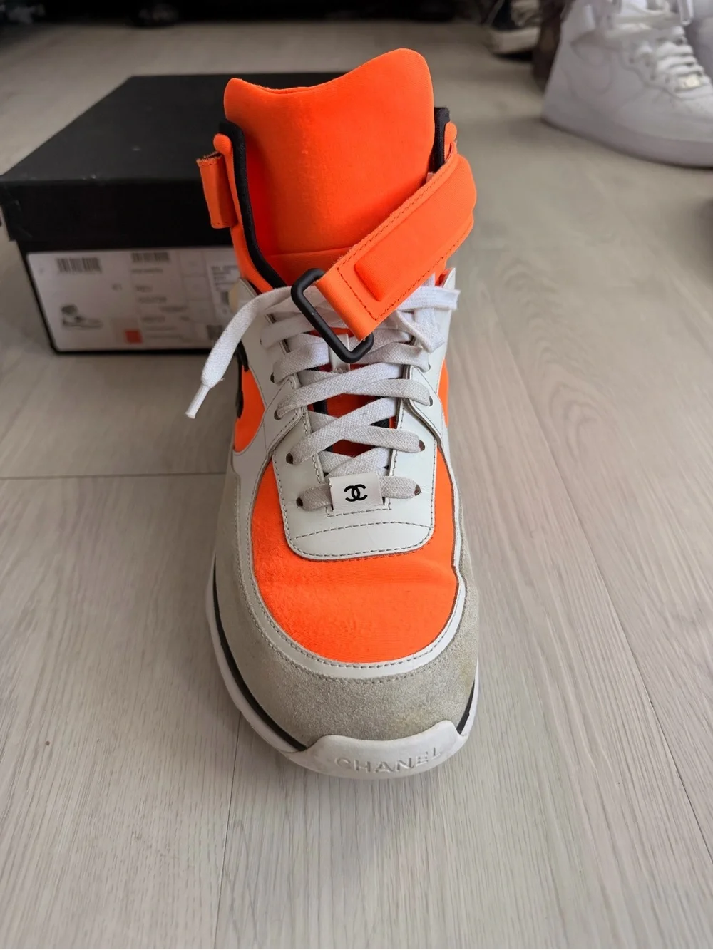 CHANEL Orange and Black High-Top Sneaker